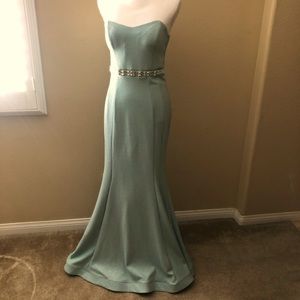 A Shimmering juniors blue gown with rhinestones